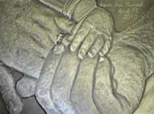 Bronze Picture of a family holding each others hands